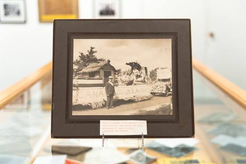 This is a photo, from an earlier era of the Ukrainian parish, of the float in a parade. This photo shows the award-winning parade in long view. / Photo: Beaton Institute Collections / CKP_3877