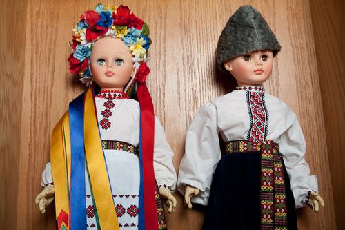 The dolls in this photo appear in the exhibit on loan from Sister Rachel Tataryn, a descendent of Ukrainian immigrants who settled in the Whitney Pier areas of Sydney, Nova Scotia. / Dolls: Sr. Rachel / CKP_4588