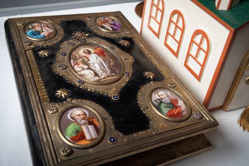 The Gospel on the altar was printed around 1900 in Zhovkva (a city in present-day Ukraine) - on a printing press in the Basilian monastery. It was donated to the Holy Ghost Ukrainian Catholic church, by Michael and Katheryn Mareniak, in 1914. The Gospel, of all church material of the time, is in the old Church Slavonic language.

The kivot, or Tabernacle, is a miniature replica of the Holy Ghost Ukrainian Church that stands today. It was made by a member of the parish and normally sits on the altar in the church.